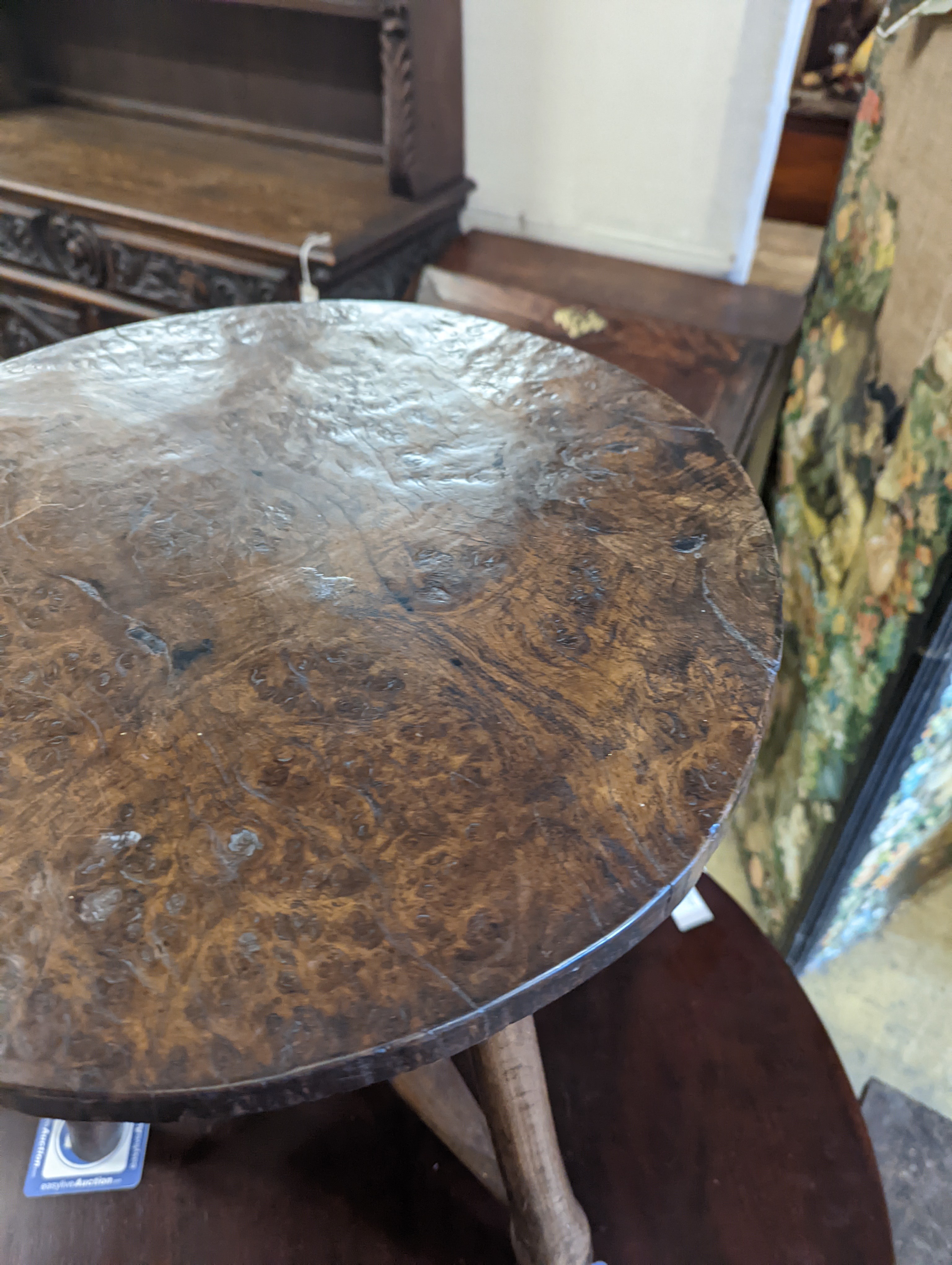 A late 18th / early 19th century circular burr elm and ash cricket table, diameter 60cm, height 62cm